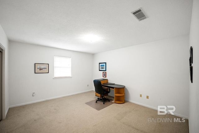 35788 Boykin Blvd, Lillian, AL 36549 - unfurnished office with a textured ceiling, baseboards, visible vents, and carpet