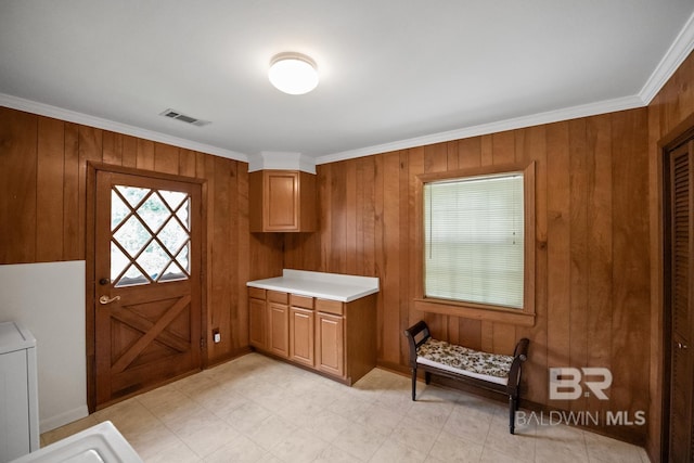 35788 Boykin Blvd, Lillian, AL 36549 - interior space with ornamental molding, wood walls, cabinet space, and visible vents