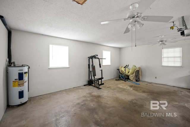 35788 Boykin Blvd, Lillian, AL 36549 - interior space featuring water heater, a garage door opener, and a ceiling fan