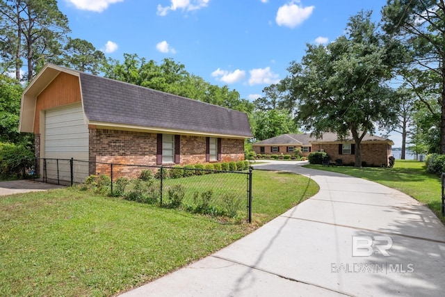 35788 Boykin Blvd, Lillian, AL 36549 - view of front of property with brick siding, a garage, a front lawn, and fence