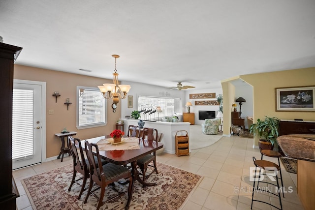 35788 Boykin Blvd, Lillian, AL 36549 - dining room with visible vents, ceiling fan with notable chandelier, and light tile patterned floors