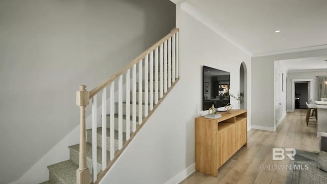 6158 Milo Loop, Gulf Shores, AL 36542 - stairway featuring hardwood / wood-style flooring, arched walkways, ornamental molding, and recessed lighting