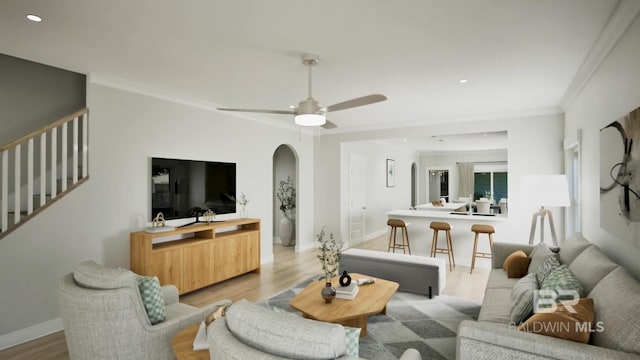 6158 Milo Loop, Gulf Shores, AL 36542 - living area with light wood-style flooring, stairway, ceiling fan, recessed lighting, and arched walkways