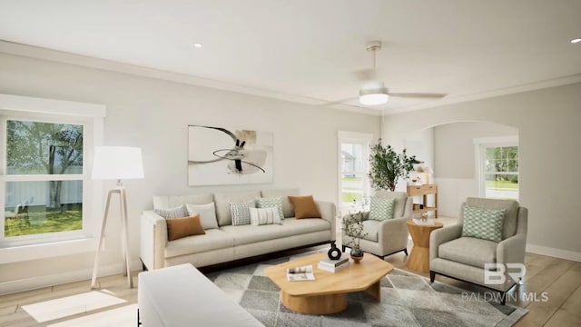 6158 Milo Loop, Gulf Shores, AL 36542 - living room featuring arched walkways, ornamental molding, light wood-type flooring, and ceiling fan
