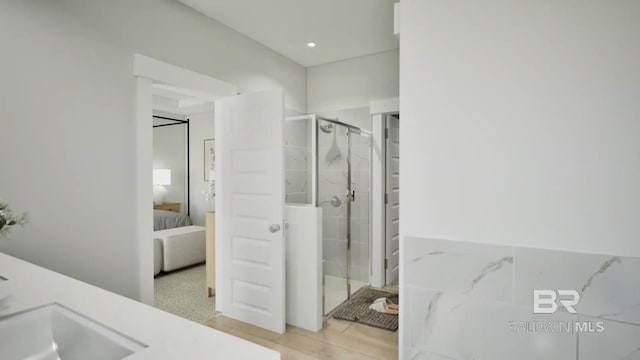 6158 Milo Loop, Gulf Shores, AL 36542 - ensuite bathroom featuring a stall shower and wood finished floors