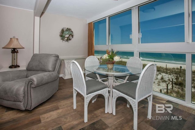 dining space with dark hardwood / wood-style floors