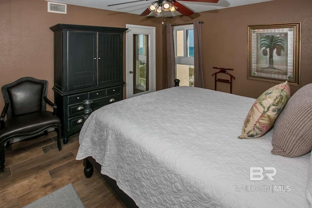 bedroom featuring dark hardwood / wood-style floors and ceiling fan