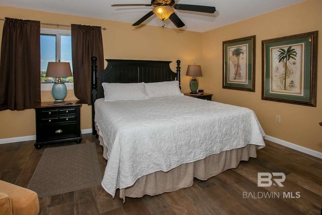 bedroom featuring dark hardwood / wood-style flooring and ceiling fan