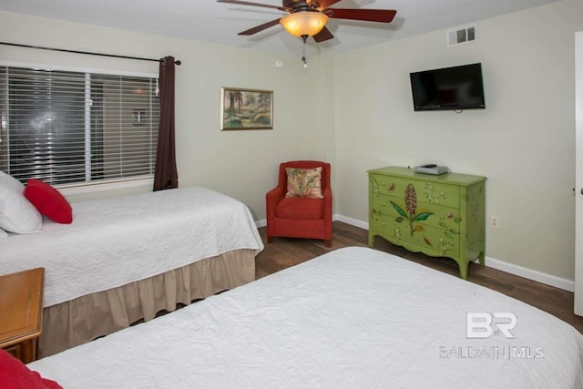 bedroom featuring dark hardwood / wood-style flooring and ceiling fan