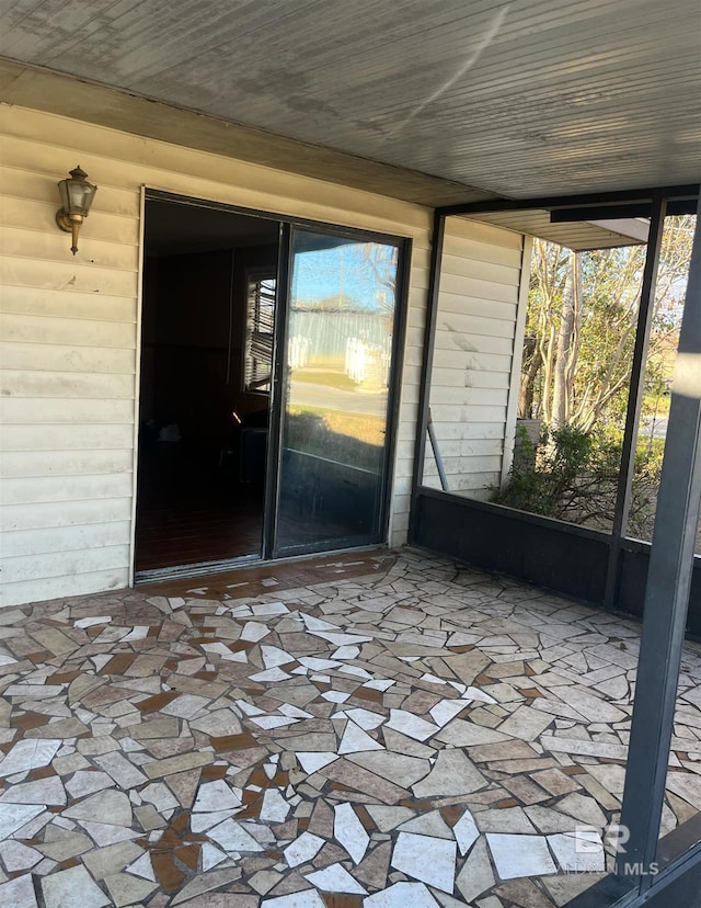 unfurnished sunroom with a healthy amount of sunlight