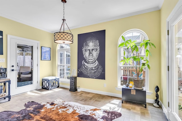 entryway featuring brick floor, baseboards, and ornamental molding