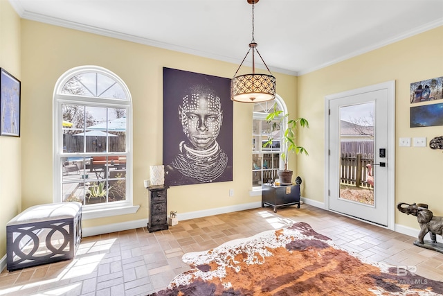 sitting room with brick floor, baseboards, and ornamental molding