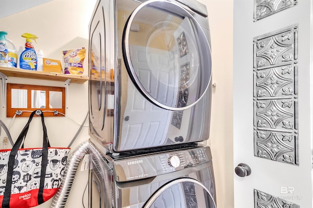 laundry area with stacked washer and dryer