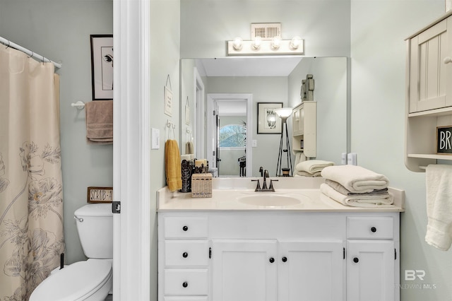 full bathroom with vanity and toilet