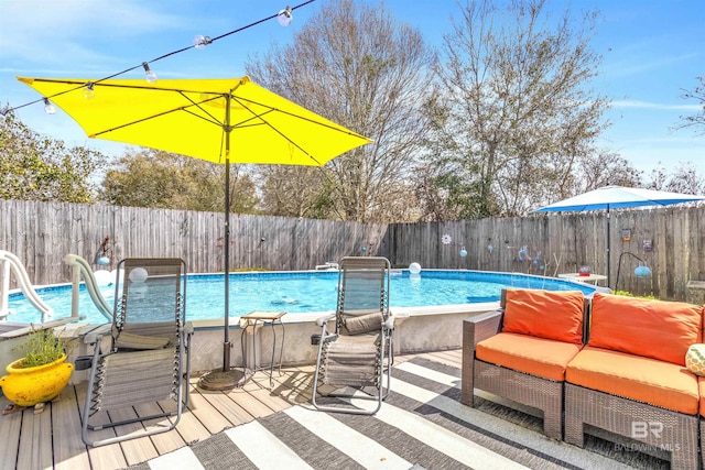 view of swimming pool featuring a fenced in pool and a fenced backyard