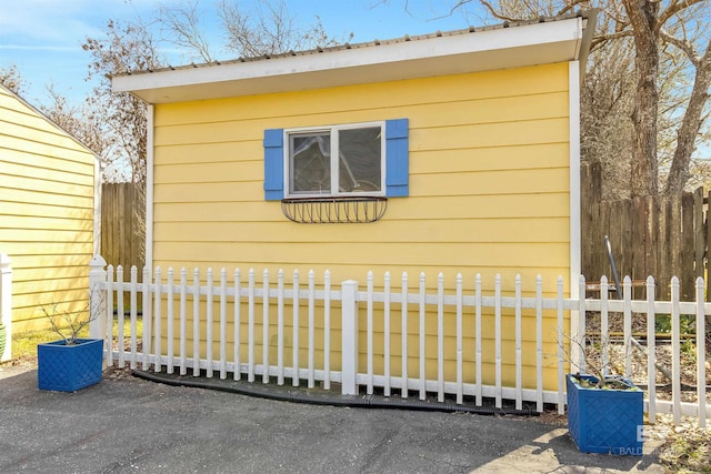 view of outdoor structure with fence