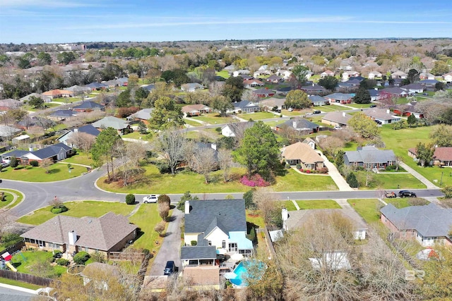 birds eye view of property with a residential view