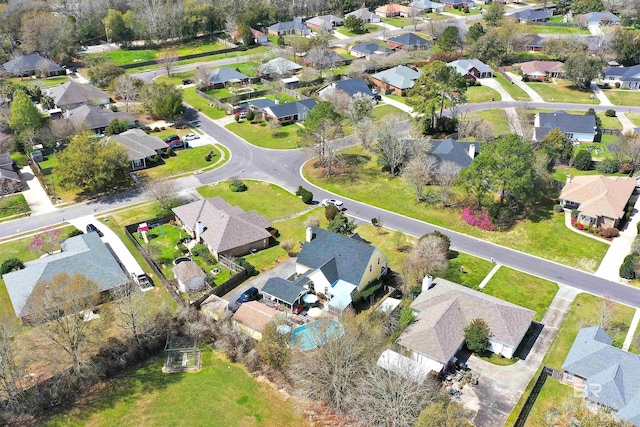 birds eye view of property with a residential view