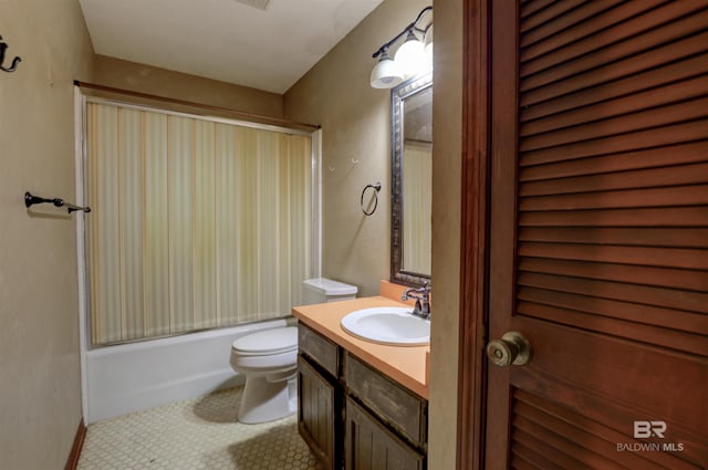 full bathroom with tile patterned floors, vanity, toilet, and shower / bath combination with glass door