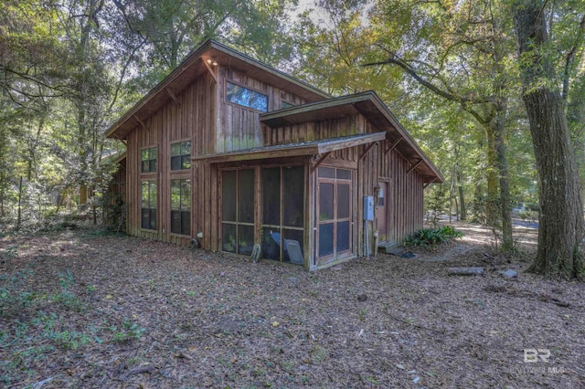 exterior space with a sunroom