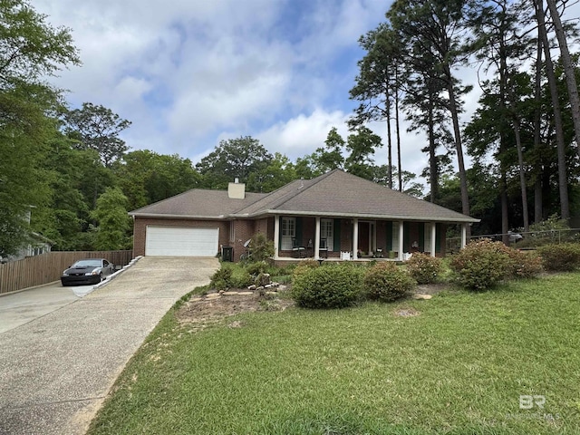 ranch-style home featuring concrete driveway, a front yard, a porch, and a garage