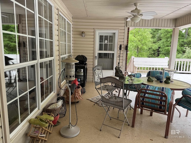 exterior space with outdoor dining space and ceiling fan