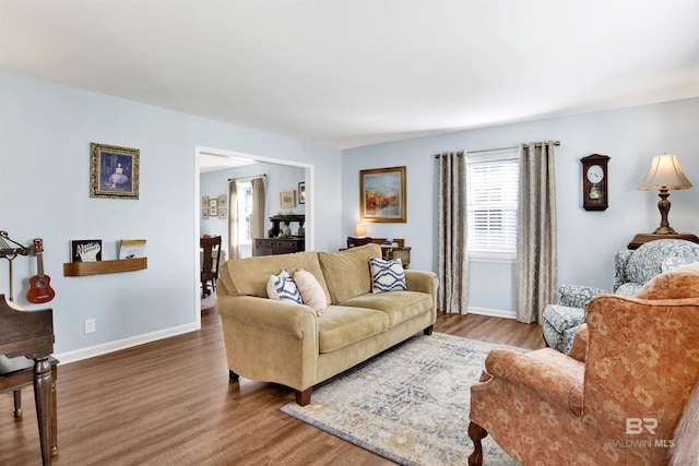 living room with wood finished floors and baseboards