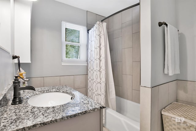 full bath featuring shower / bathtub combination with curtain and vanity