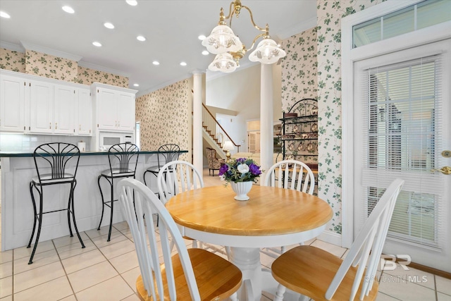 9330 Timbercreek Blvd, Daphne, AL 36527 - dining room with crown molding, wallpapered walls, light tile patterned floors, stairway, and recessed lighting