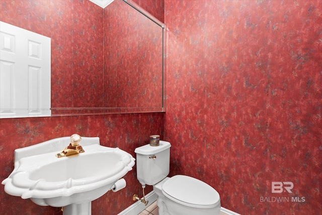 9330 Timbercreek Blvd, Daphne, AL 36527 - half bath featuring toilet, baseboards, and a sink