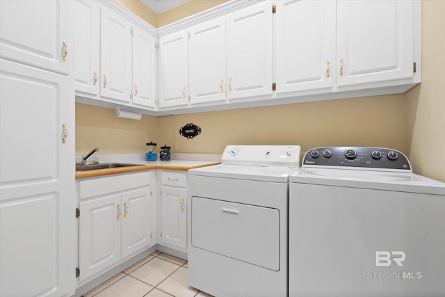 9330 Timbercreek Blvd, Daphne, AL 36527 - washroom featuring washer and clothes dryer, cabinet space, and light tile patterned floors