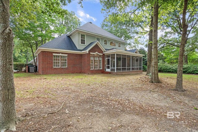 9330 Timbercreek Blvd, Daphne, AL 36527 - back of house featuring a sunroom, cooling unit, a shingled roof, and brick siding