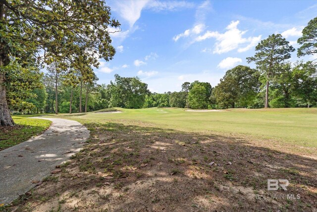 9330 Timbercreek Blvd, Daphne, AL 36527 - view of community featuring view of wooded area, golf course view, and a lawn
