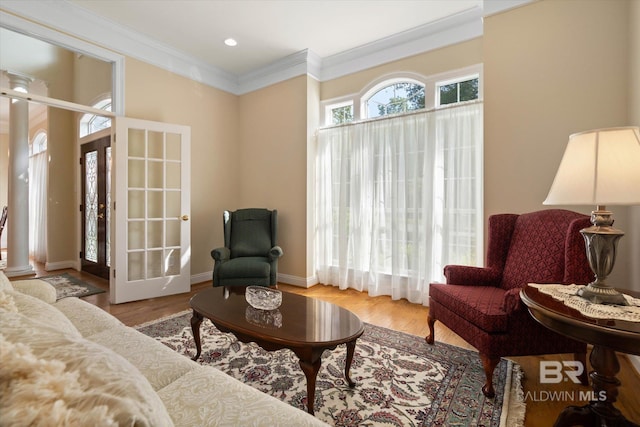 9330 Timbercreek Blvd, Daphne, AL 36527 - living area with crown molding, wood finished floors, french doors, baseboards, and ornate columns