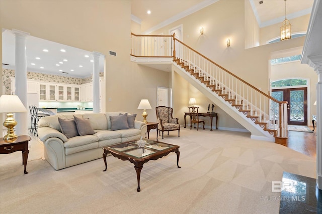 9330 Timbercreek Blvd, Daphne, AL 36527 - carpeted living area with ornate columns, a high ceiling, stairway, ornamental molding, and baseboards