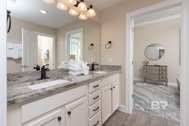 bathroom with vanity and hardwood / wood-style flooring