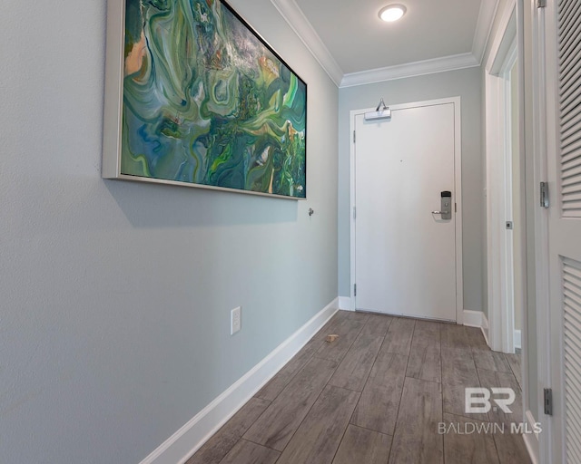 doorway featuring ornamental molding and hardwood / wood-style floors