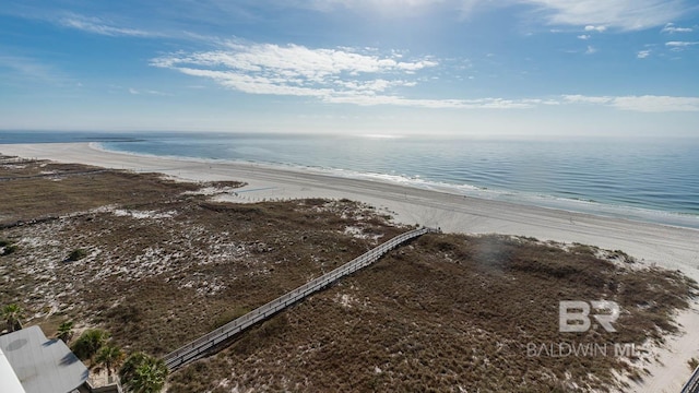 birds eye view of property featuring a beach view and a water view