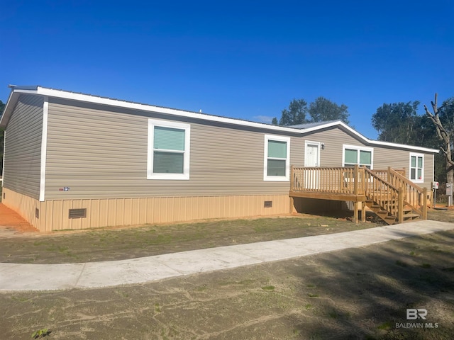 view of property exterior with a deck