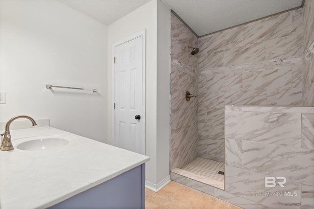 full bath with tiled shower and vanity