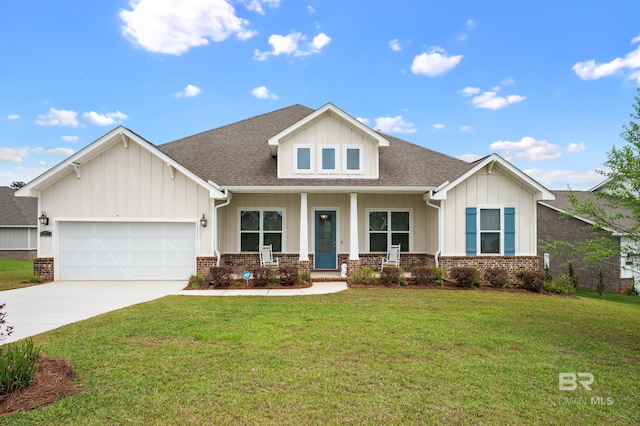 9377 Diamante Blvd, Daphne, AL 36526 - view of front of house featuring a garage, a front lawn, board and batten siding, and concrete driveway