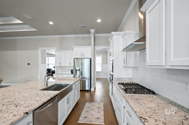 9377 Diamante Blvd, Daphne, AL 36526 - kitchen featuring a sink, wall chimney range hood, a wealth of natural light, and stainless steel appliances