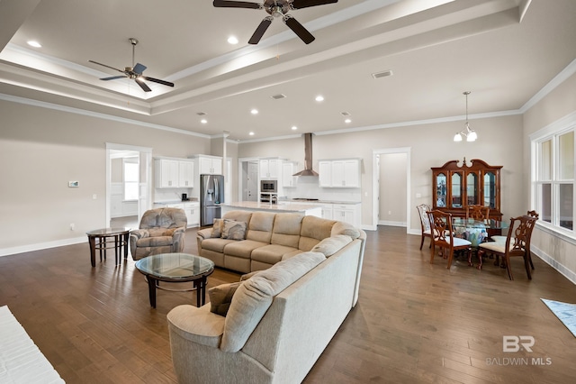 9377 Diamante Blvd, Daphne, AL 36526 - living room with a raised ceiling, visible vents, dark wood finished floors, and ceiling fan