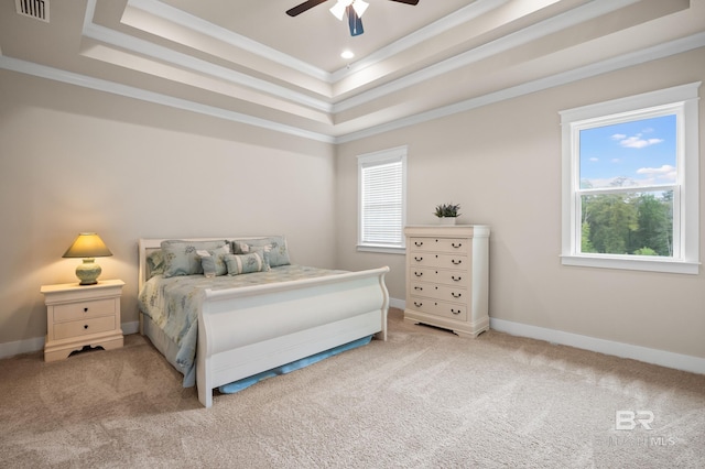 9377 Diamante Blvd, Daphne, AL 36526 - bedroom featuring a tray ceiling, multiple windows, and carpet floors
