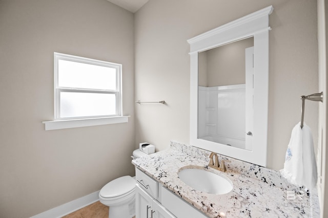 9377 Diamante Blvd, Daphne, AL 36526 - full bathroom featuring a shower, vanity, baseboards, and toilet