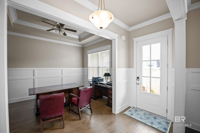 9377 Diamante Blvd, Daphne, AL 36526 - interior space featuring ornamental molding, a ceiling fan, a tray ceiling, wood finished floors, and a wainscoted wall