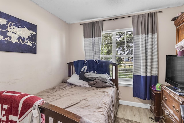 221 Howard Cir, Gulf Shores, AL 36542 - bedroom featuring light wood finished floors and baseboards