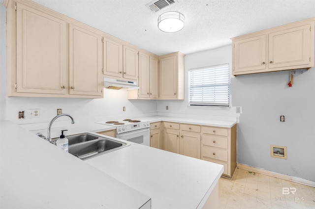 kitchen with kitchen peninsula, sink, light tile floors, white range with electric cooktop, and a textured ceiling