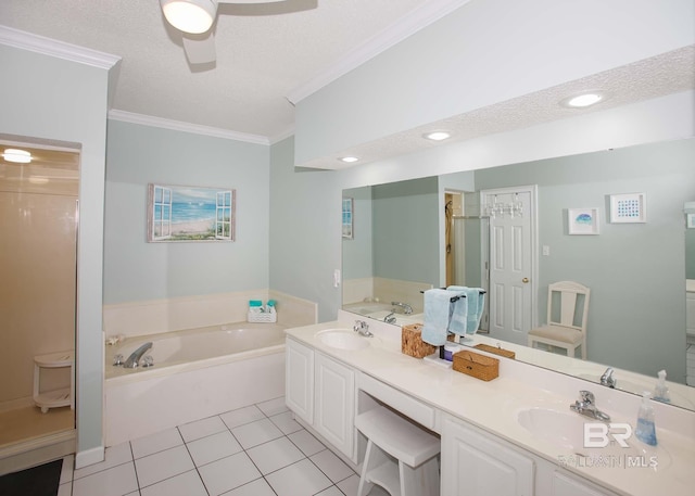 bathroom featuring a washtub, tile patterned floors, double sink vanity, and a textured ceiling