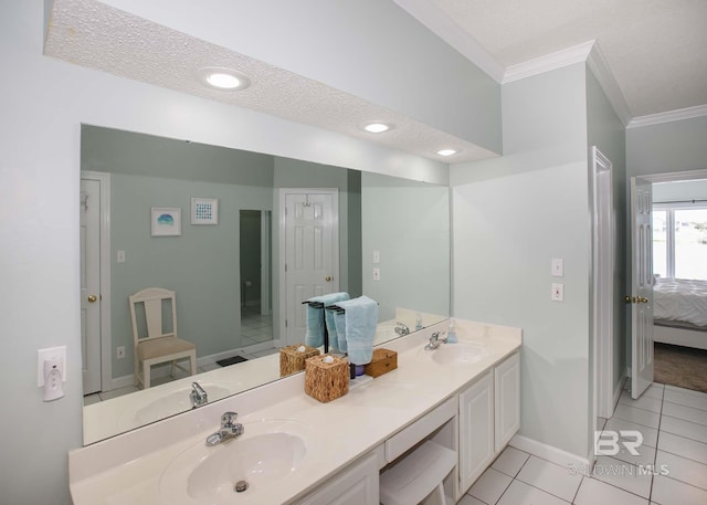 bathroom with double vanity, tile patterned floors, crown molding, and a textured ceiling